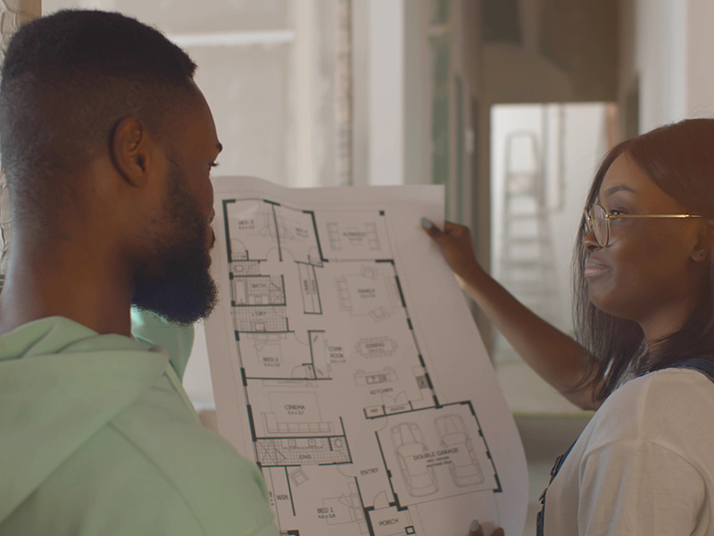 couple with floorplan